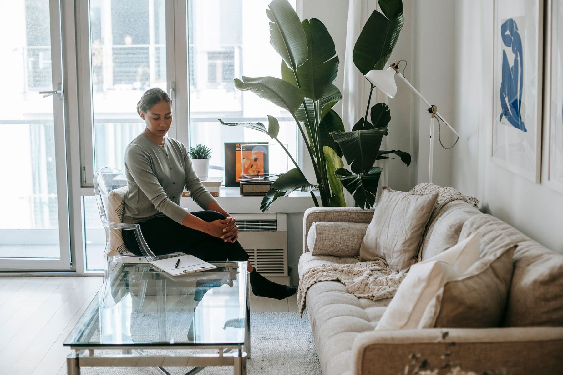 A therapist seated in a calm private-practice office