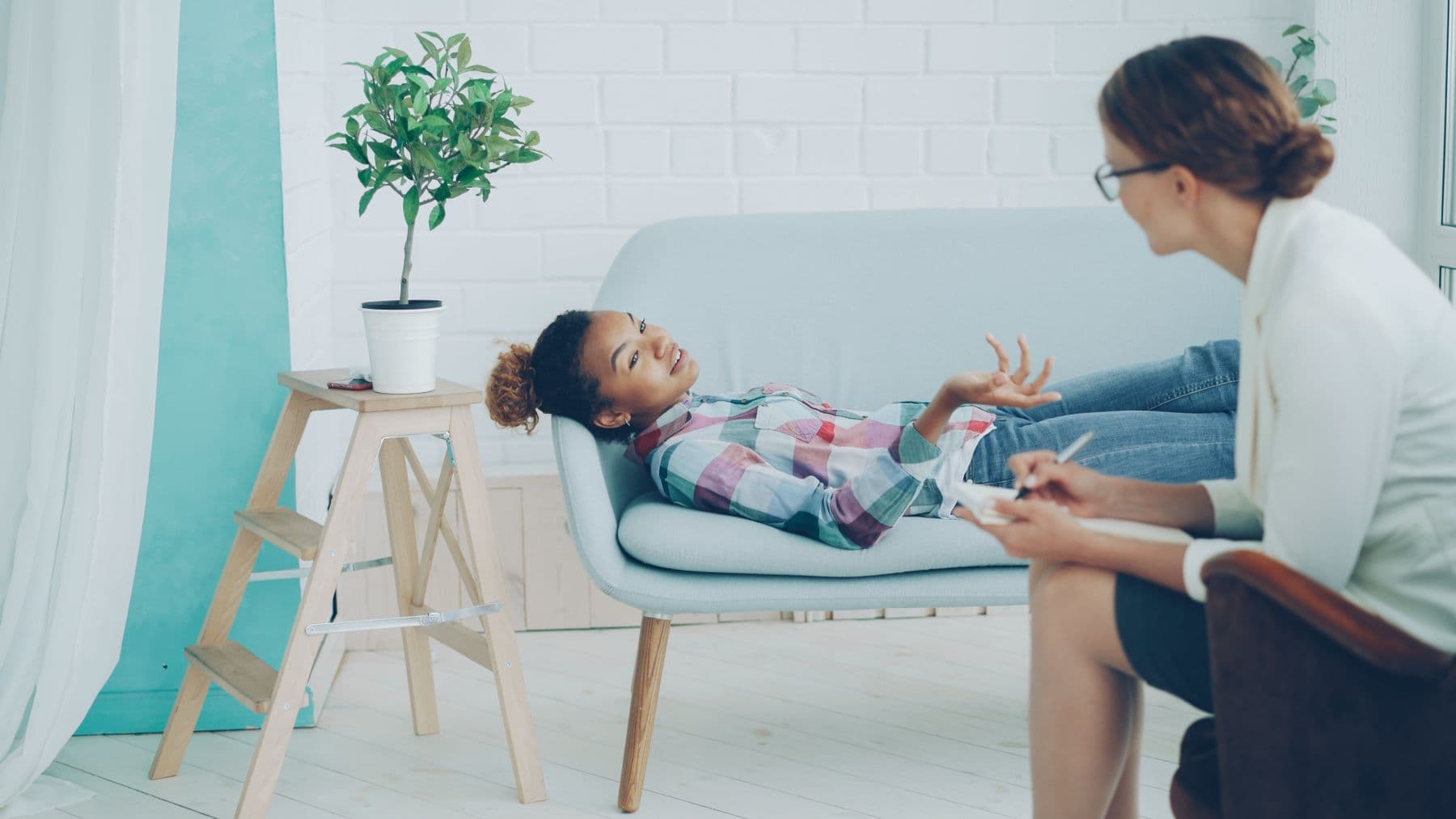 A therapist and client in a calm private-practice office